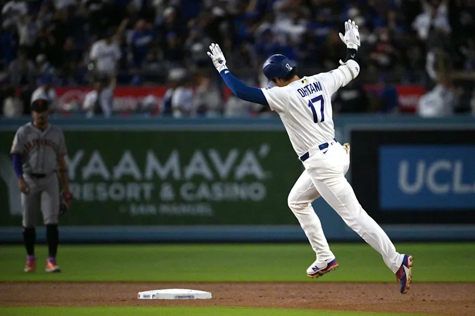May 12, 2026; Los Angeles, California, USA; Los Angeles Dodgers designated hitter Shohei Ohtani (17) acknowledges the Dodgers bullpen and runs the bases after hitting a one run home run against San Francisco Giants starting pitcher Adrian Houser (not pictured) during the third inning at Dodger Stadium. -- © Jayne Kamin-Oncea-Imagn Images 
