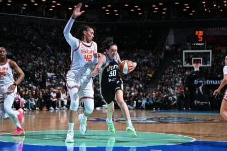 Breanna Stewart, wearing a New York Liberty uniform paying homage to the franchise’s early years, drives to the basket during Friday night’s game against the Connecticut Sun.