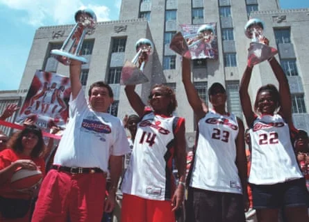 Members of the Houston Comets celebrate their WNBA championships.