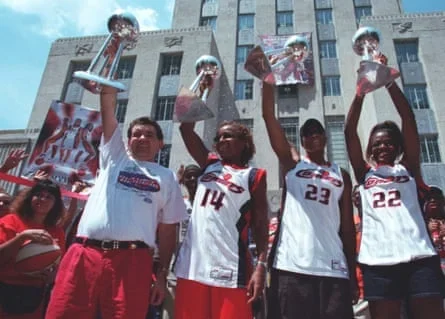 Members of the Houston Comets celebrate their WNBA championships.